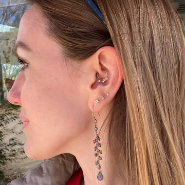 four earlobe piercings with a daith piercing at the IRIS Boulder CO shop