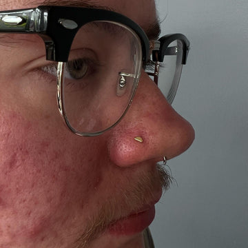 nostril face piercing completed at the Grand Rapids MI IRIS Piercing Studio