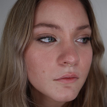 woman with a septum piercing ring on her nose that she received from IRIS Piercing Studio in Salt Lake City